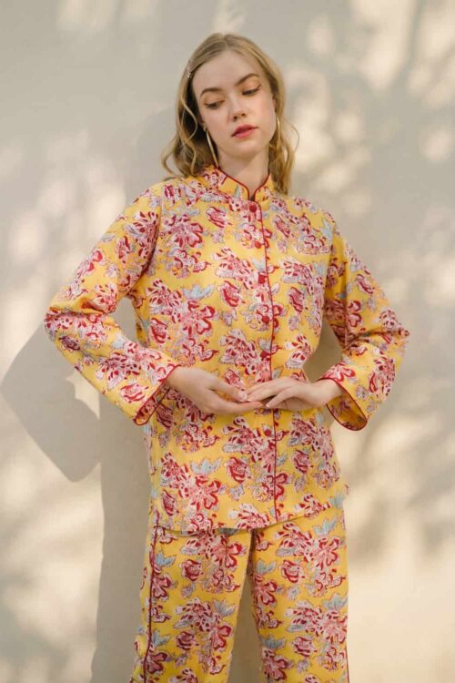 Women’s floral pajama set in yellow and pink, perfect for comfortable sleepwear.