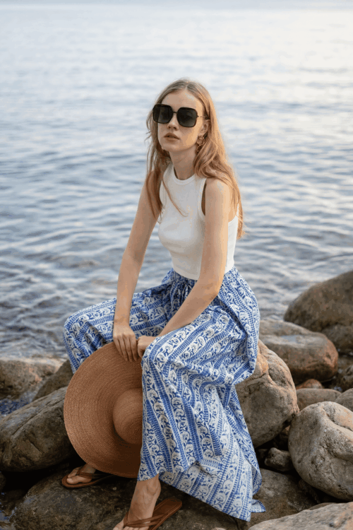 Elegant blue and white patterned trousers perfect for casual beachwear and summer days.