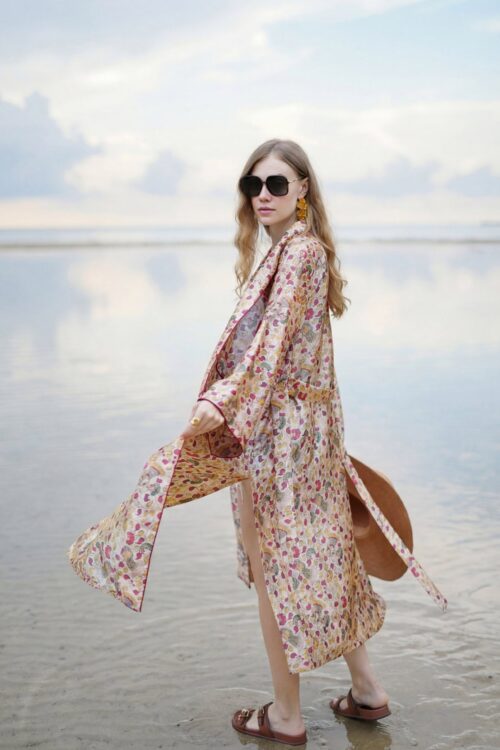 Stylish floral patterned coat with tiara-inspired design, perfect for beach or casual outings.