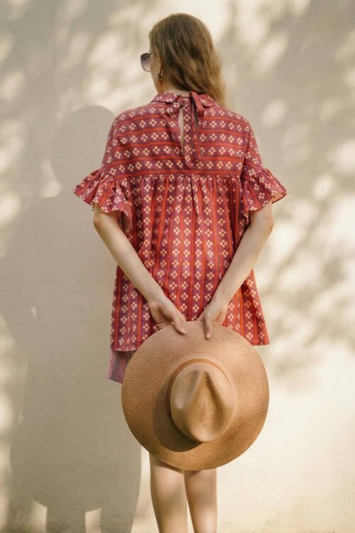 Elegant bohemian dress with ruffle sleeves, perfect for summer and outdoor events. Features intricat.