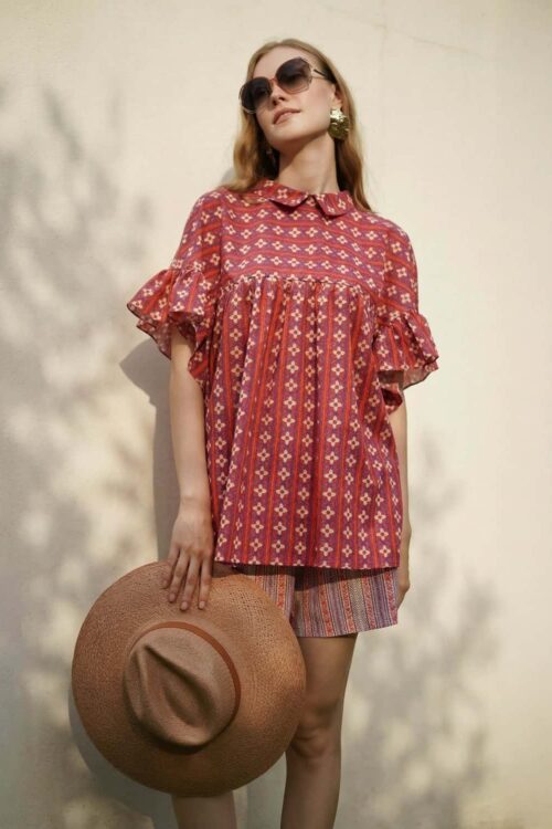 Boho style red dress with ruffled sleeves and geometric patterns, perfect for summer outings.